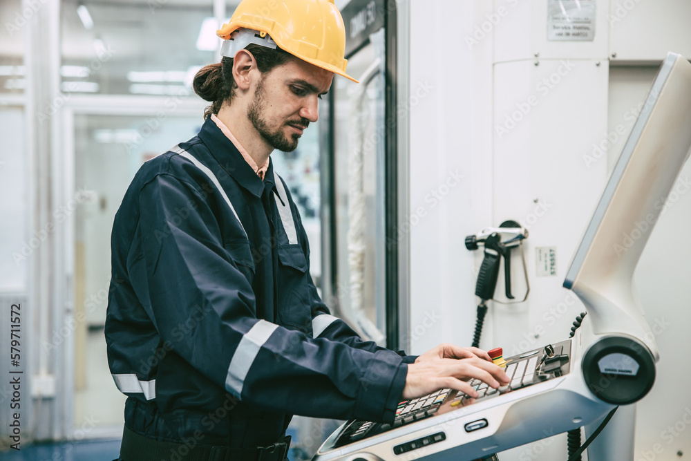 Engineer steel part technician worker control program CNC Lathe Machine in modern metal factory Engineer steel part technician worker control program CNC Lathe Machine in modern metal factory