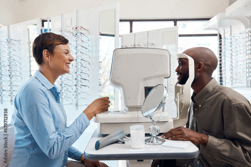 Eye care thats clearly the best. Shot of an optometrist examining her patients eyes with an autorefractor.