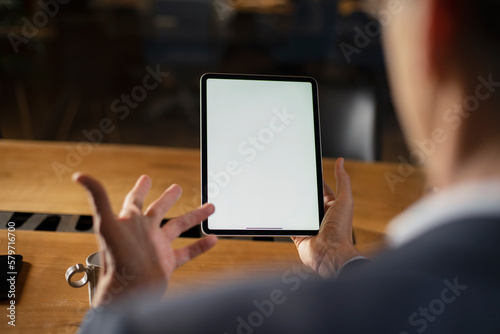 Close up of man using digital tablet.