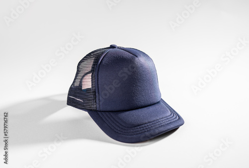 Trucker cap, navy blue, snapback, navy blue mesh. Isolated on white. Mock-up for branding