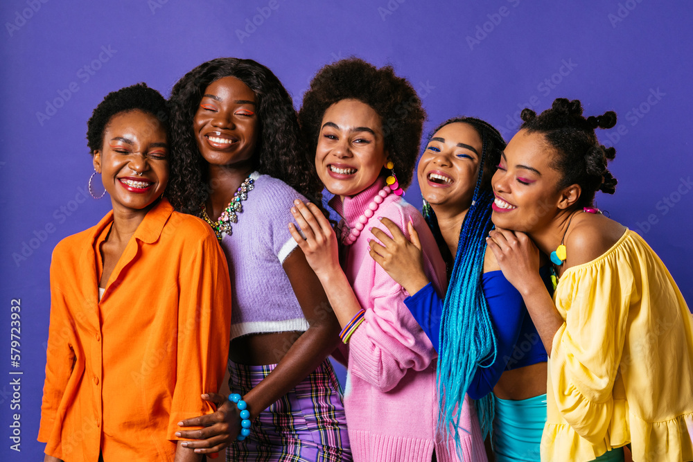 Beautiful black women wearing colorful clothes posing in studio - Multicultural female models posing in studio on background, concepts about diversity, real authentic people, women's right Beautiful black women wearing colorful clothes posing in studio - Multicultural female models posing in studio on background, concepts about diversity, real authentic people, women's right