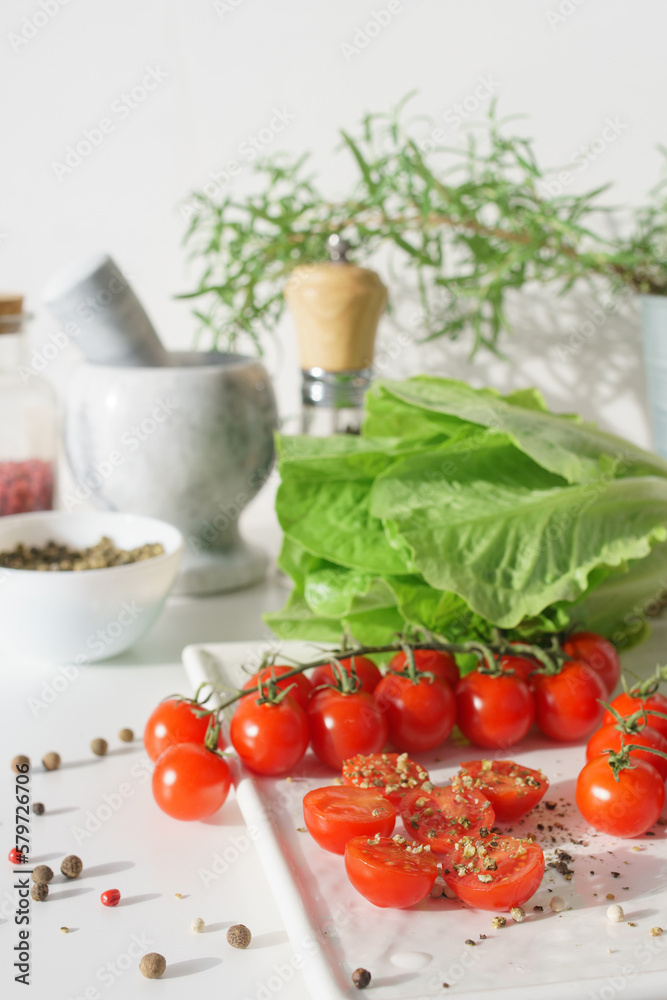 vegetables and spices. Cherry tomatoes, lettuce leaves and various spices. Red, green and black pepper. vegetables and spices. Cherry tomatoes, lettuce leaves and various spices. Red, green and black pepper.