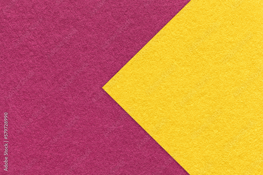 Texture of purple paper background, half two colors with yellow arrow, macro. Structure of dense craft wine cardboard. Texture of purple paper background, half two colors with yellow arrow, macro. Structure of dense craft wine cardboard.