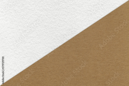 Texture of craft white and beige paper background, half two colors, macro. Vintage dense kraft brown cardboard.