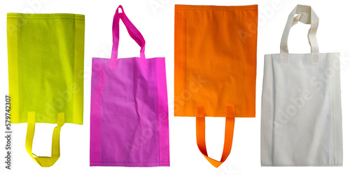 four pieces of yellow, pink, orange and ivory non-woven fabric tote bag isolated. set or collection with various colors. environmentally friendly polypropylene
