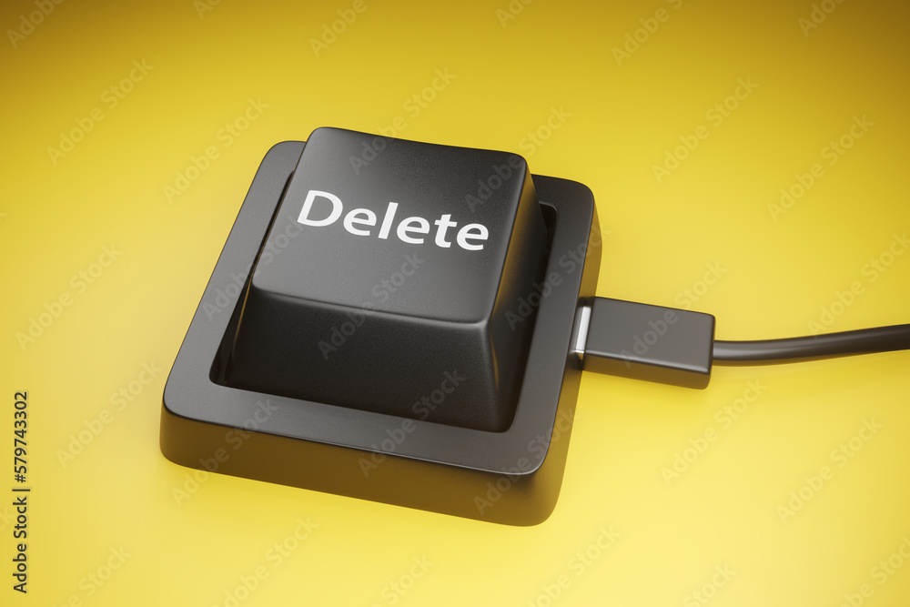 Black delete key of a keyboard on yellow background. Illustration of the concept of removal and