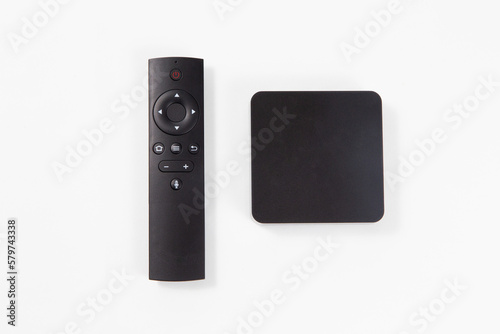 black multimedia TV box and remote controller