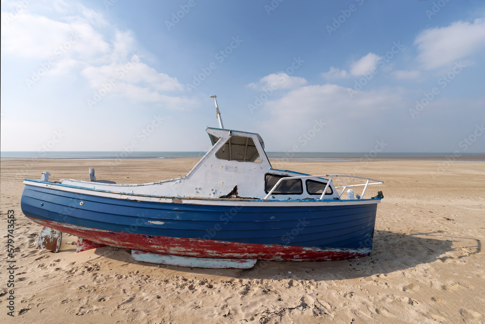 Low tide and old abandoned boat in the Cotentin coast. The havre of Saint-Germain-sur-Ay Low tide and old abandoned boat in the Cotentin coast. The havre of Saint-Germain-sur-Ay