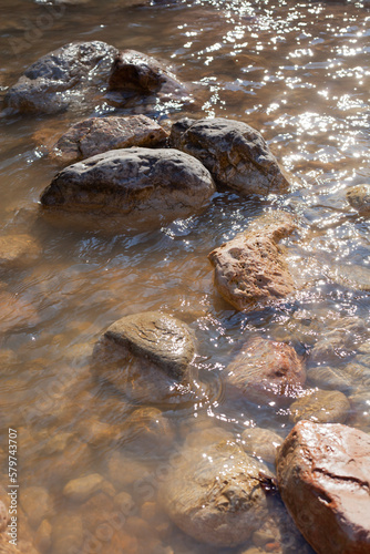 big stones in a mountain river in early spring