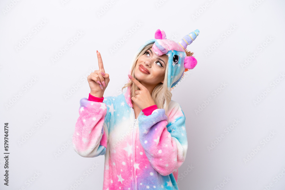 Young Russian woman with unicorn pajamas isolated on white background pointing with the index finger a great idea Young Russian woman with unicorn pajamas isolated on white background pointing with the index finger a great idea