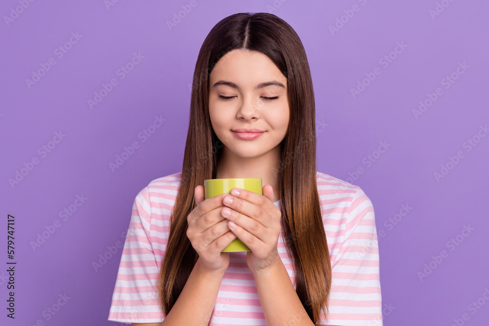 Portrait of sweet lovely person closed eyes arms hold coffee cup smell aromat isolated on purple color background Portrait of sweet lovely person closed eyes arms hold coffee cup smell aromat isolated on purple color background