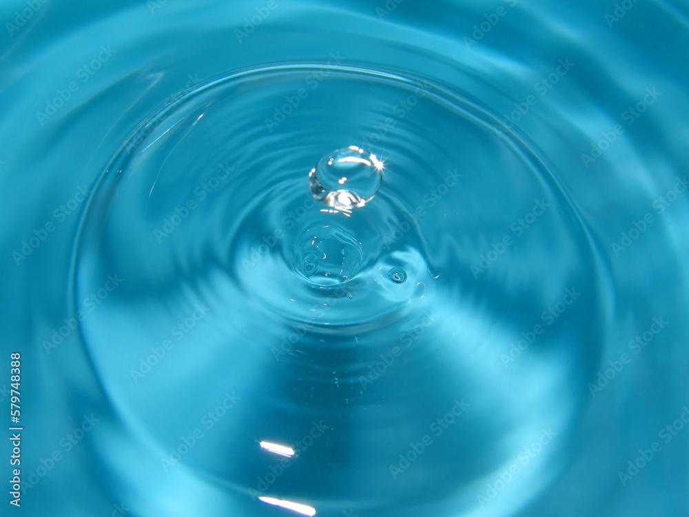 a drop falls into the water. macro photography
