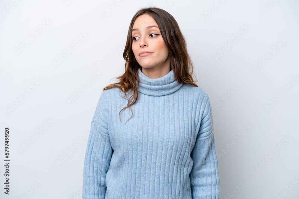 Young caucasian woman isolated on white background making doubts gesture looking side Young caucasian woman isolated on white background making doubts gesture looking side