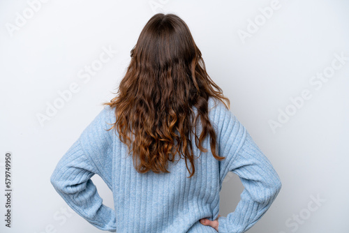 Young caucasian woman isolated on white background in back position