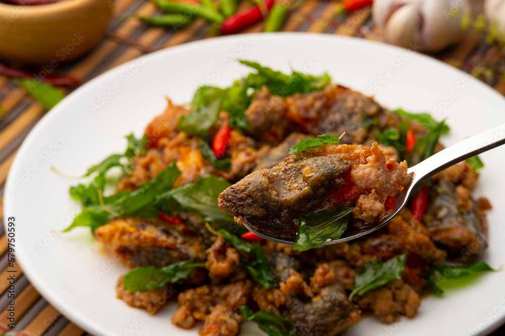 Close up Century Egg in spoon ,Stir Fried Crispy Basil with Pork and Black Preserved Egg (Kai Yiew Ma Kra Prao Krob) Close up Century Egg in spoon ,Stir Fried Crispy Basil with Pork and Black Preserved Egg (Kai Yiew Ma Kra Prao Krob)