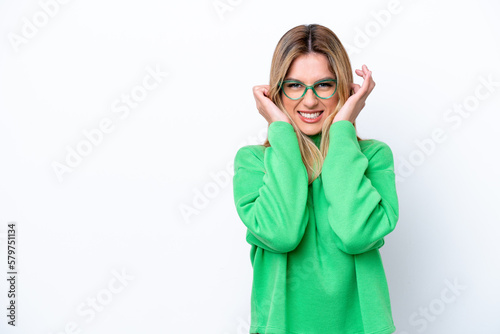 Young Uruguayan woman isolated on white background frustrated and covering ears