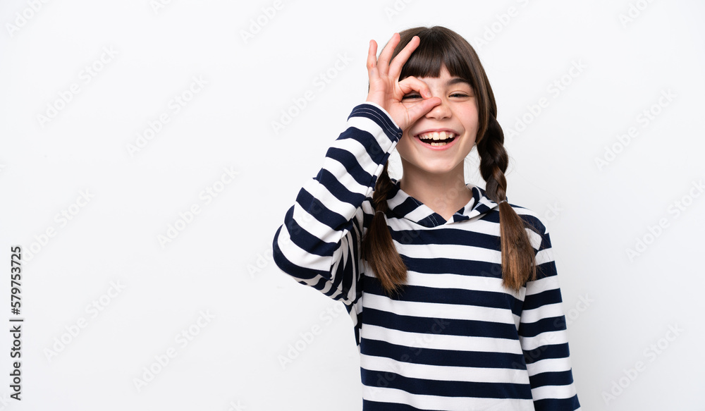 Little caucasian girl isolated on white background showing ok sign with fingers Little caucasian girl isolated on white background showing ok sign with fingers