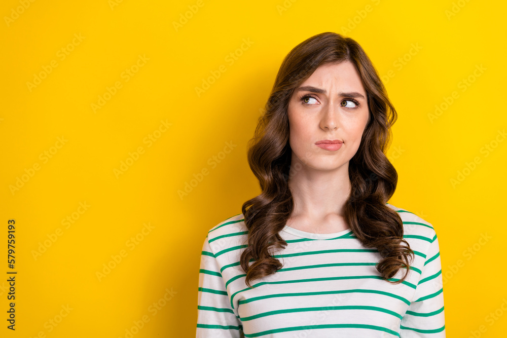 Photo of minded ponder thinking lady look empty space pouted lips distrust choosing product high price sceptical isolated on yellow color background Photo of minded ponder thinking lady look empty space pouted lips distrust choosing product high price sceptical isolated on yellow color background