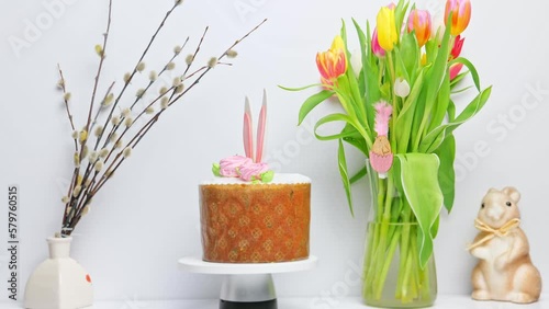 Delicious Traditional Symbol of Easter, bunny cake or sweet bread with meringue, flowers. Happy Spring Holiday. Easter Festive Treat. Selective focus