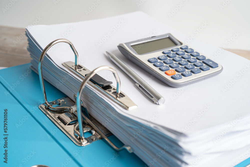 Calculator on finder data finance report business with graph analysis in office. Calculator on finder data finance report business with graph analysis in office.