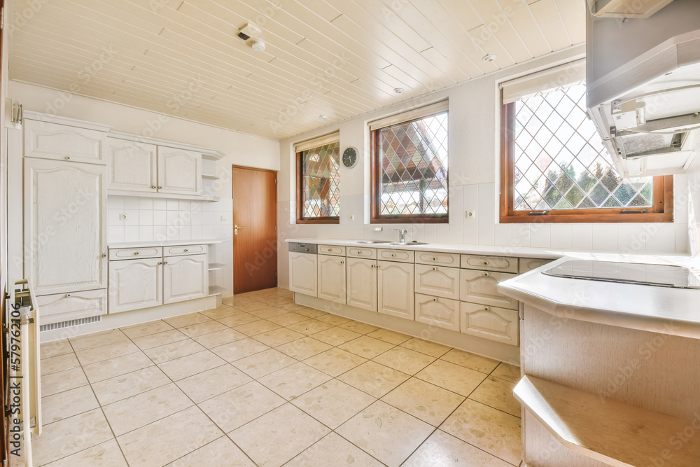 Kitchen with modern appliances and white furniture Kitchen with modern appliances and white furniture