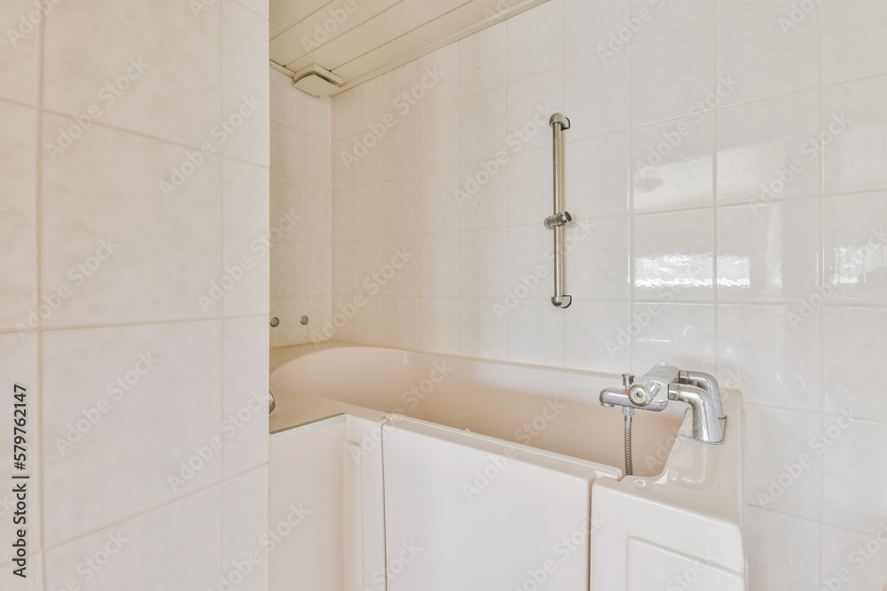 Modern bathroom with bathtub and handle Modern bathroom with bathtub and handle