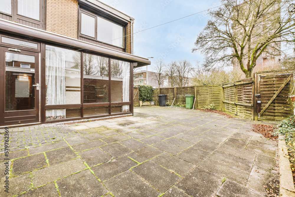 Exterior of residential house with paved terrace Exterior of residential house with paved terrace
