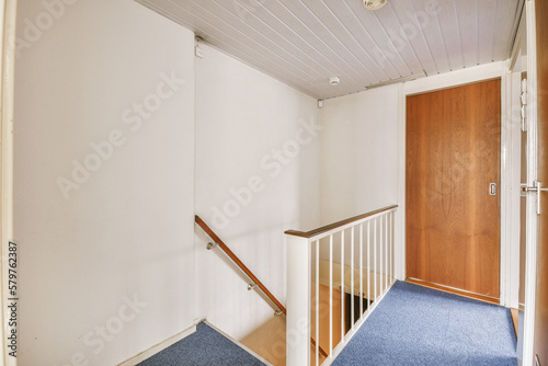 Staircase leading to first floor in house