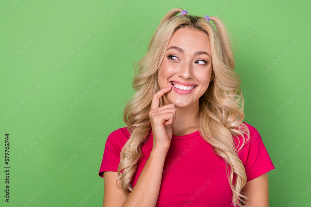 Fototapeta premium Photo of thoughtful adorable lady dressed pink t-shirt finger mouth looking emtpy space isolated green color background