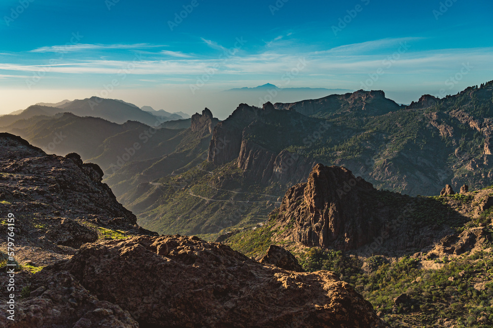 View of Rocky Ravine with Tenerife in the Background in Gran Canaria, Spain