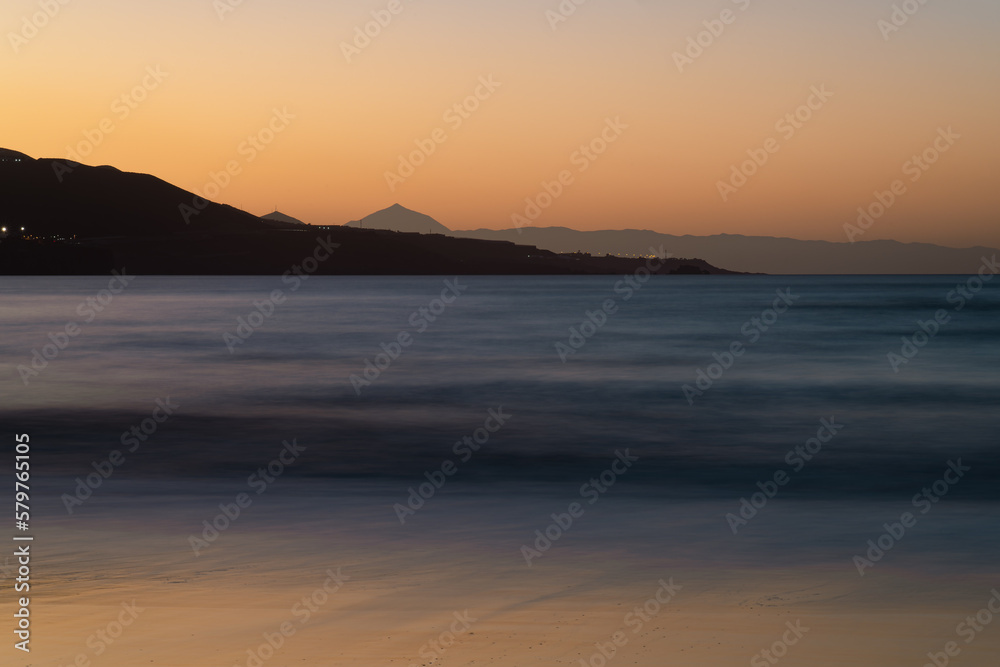 Beautiful View of Sunset from Las Canteras Beach, Gran Canaria, with Tenerife's Mount Teide in the Background