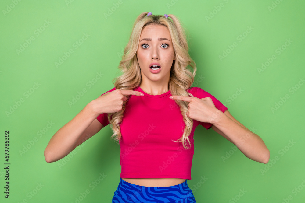 Photo of young stressed unhappy amazed lady wear pink t-shirt direct fingers herself blamed questioned accusation isolated on green color background - obrazy, fototapety, plakaty 