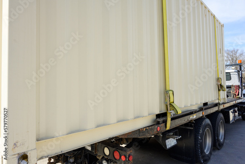 White Container Truck with yellow tie down strap