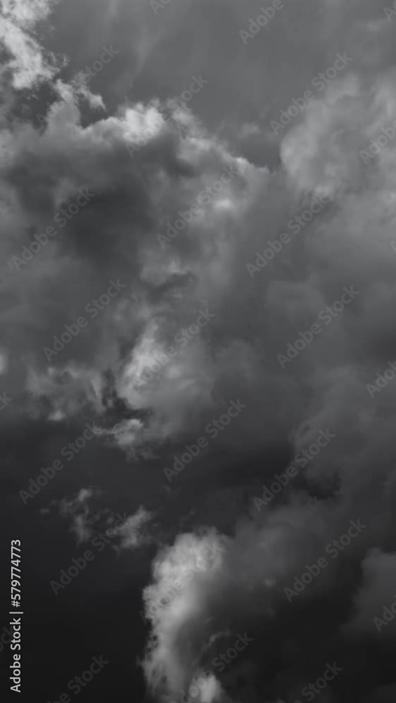 Dramatic dark storm clouds are moving fast, timelapse. Vertical video Dramatic dark storm clouds are moving fast, timelapse. Vertical video