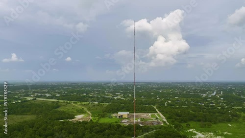 Aerial view of telecommunications cell phone tower with wireless communication 5g antennas for network signal transmission
