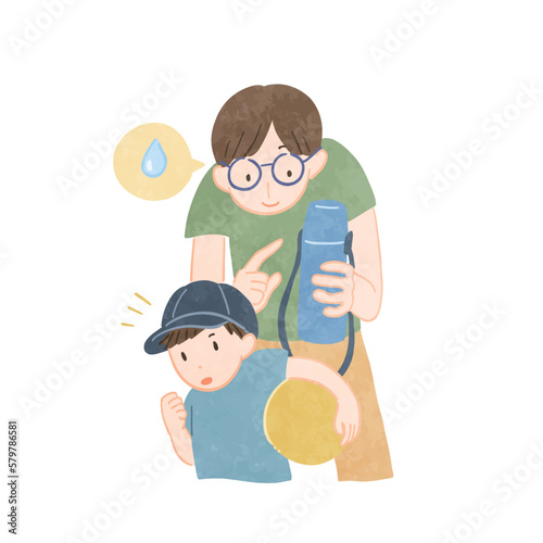 子供に水分補給を促す男性