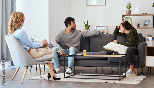 Keep talking until the answers become clearer. Shot of a couple having an argument during a counseling session with a therapist.
