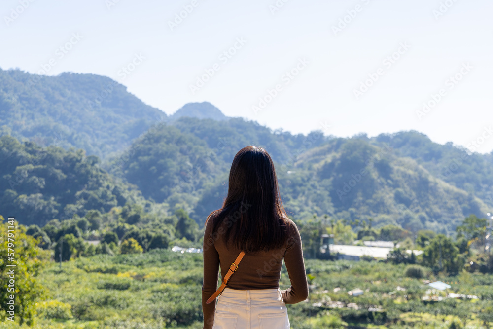 Woman enjoy the mountain view in countryside