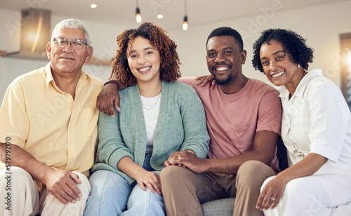 Big family, smile and portrait in home living room, joy and having fun together on sofa. Interracial, love and happy grandfather, grandmother and couple smiling in lounge and enjoying holiday time.