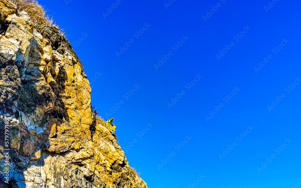 Mountain panorama cliffs rocks hilly tropical landscape Puerto Escondido Mexico.