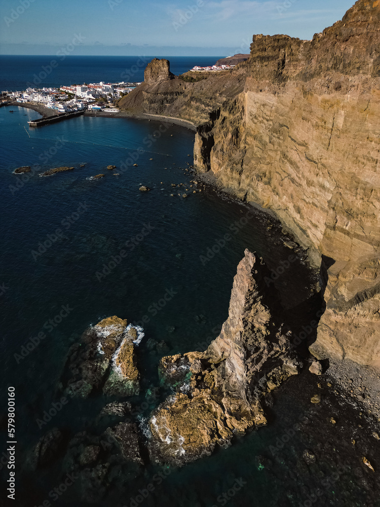 Aerial view of broken Dedo de Dios rock formation in Puerto de las Nieves, Agaete, in the northern coast of Gran Canaria, Spain