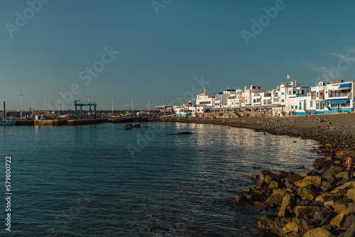 View of pebble beach in traditional whitewashed village, Puerto de las Nieves, Agaete, in northern coast of Gran Canaria, Spain photo