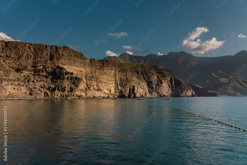 View of rocky high cliffs near Puerto de las Nieves, Agaete, in northern coast of Gran Canaria, Spain