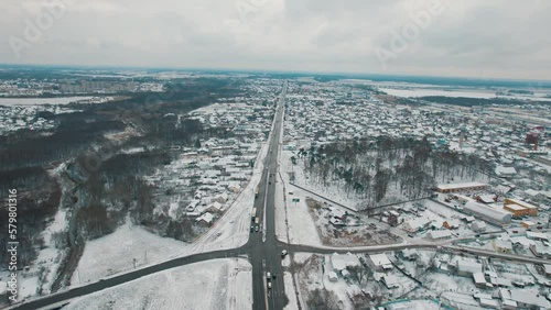 Aerial view of the traffic of cars at the crossroads in the area of the city with private houses photo