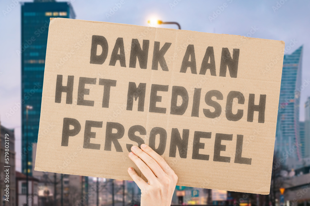 The phrase " Thank you hospital workers " on a banner in hand. The