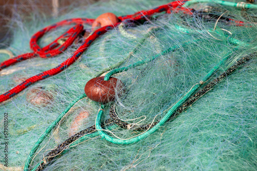 reti da pesca accatastate ad asciugare in bidoni  photo