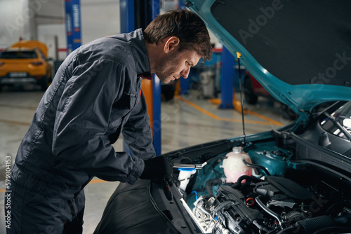 Man conducts full technical check of auto