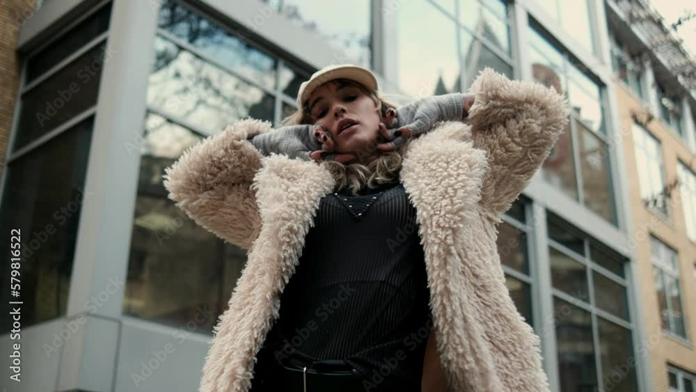 Young model woman doing a photoshoot in a London street. Young model woman doing a photoshoot in a London street.