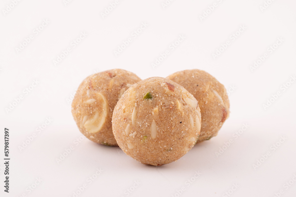 Pinni Ladoo with dry fruits isolated on white background, Gond Laddu Healthy Sweet