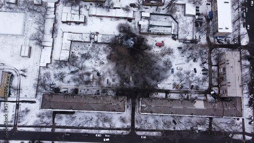 Kiev, Ukraine - 08 March 2023: Aerial view of bombed residential building with snow in winter during the war between Russia and Ukraine. photo